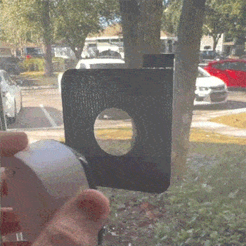 Thrumina camera being mounted on a window to cover blind spots